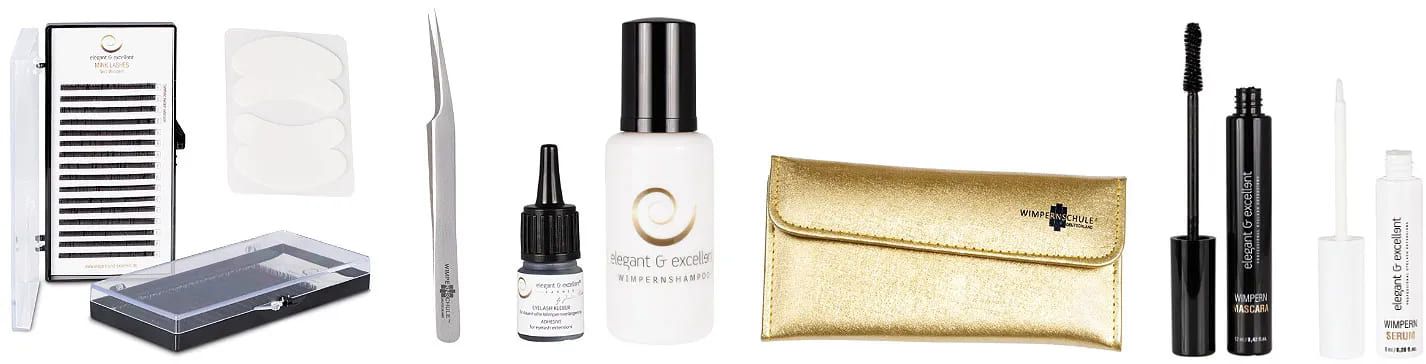 Box mit Wimpernverlängerungen, eine Pinzette für die Wimpern, sowie Kleber und eine kleine weiße Flasche mit schwarzem Deckel Wimpernschampoo, eine goldene Kosmetiktasche mit der Aufschrift Wimpernschule Hannover, Mascara und ein Wimpernserum mit Applikator